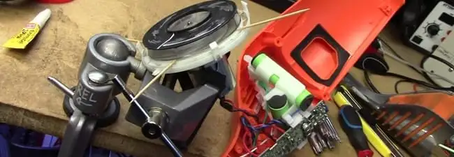 Vacuum cleaner repair parts and tools on a workbench in Lakewood, CO